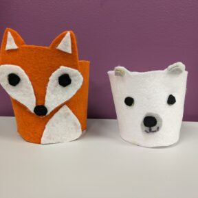 Felt cup cozies of a fox and a polar bear
