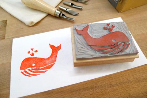 Carved rubber stamp of whale