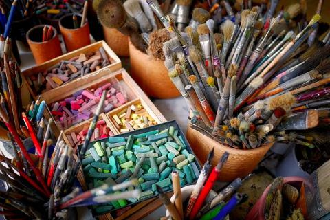 paintbrushes, colored chalk, painting supplies
