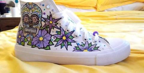 Picture of hand painted white shoes with skull and flowers