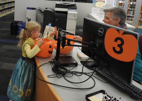 Kids trick or treating in the library