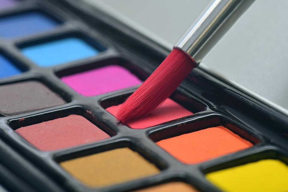 watercolor palette and paintbrush