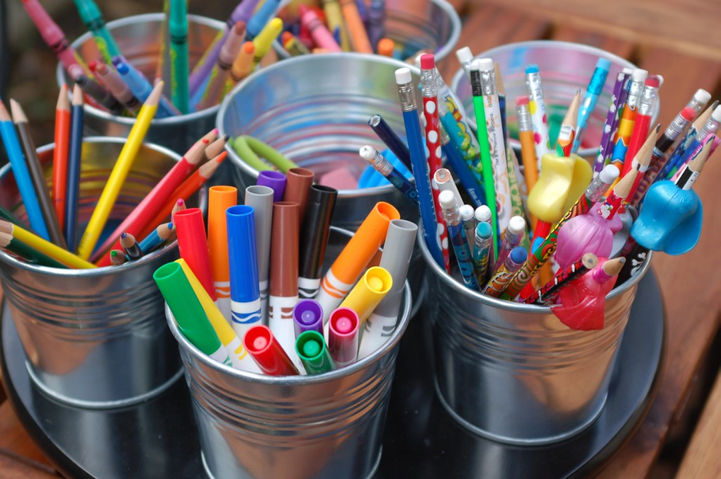 Craft supplies in gray buckets