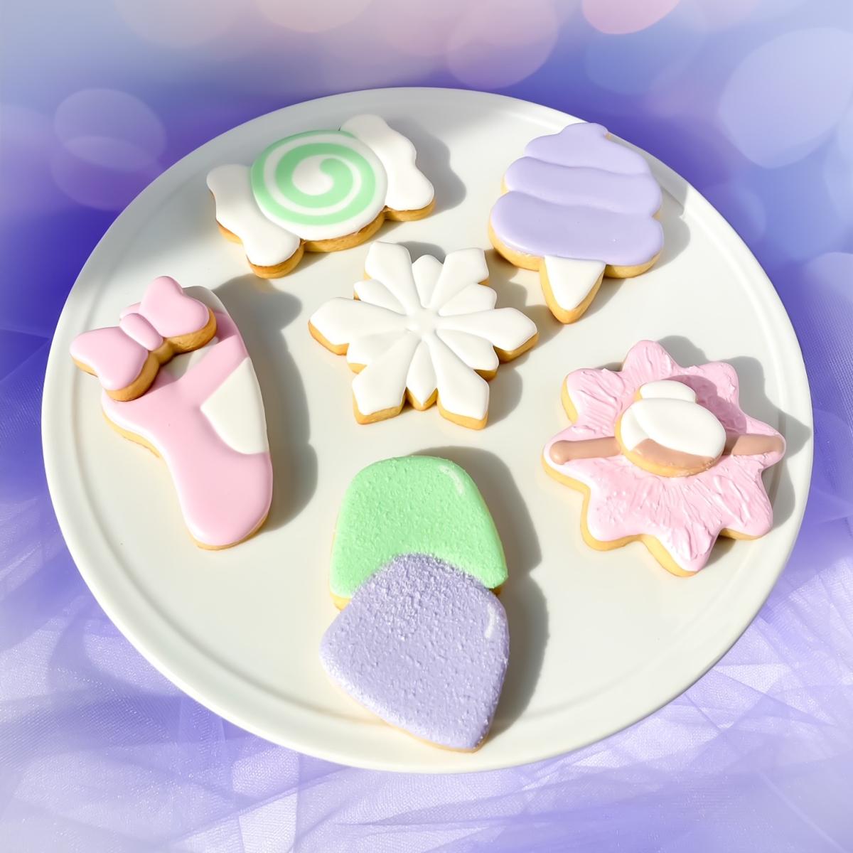 Photo of sugar plum themed iced cookies